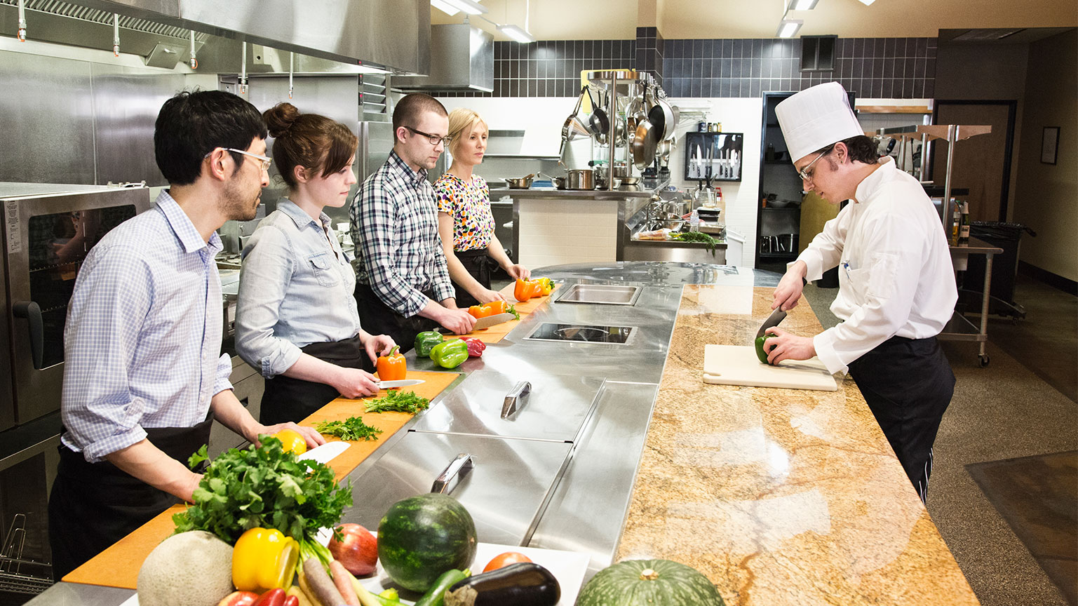 a-caucasian-male-chef-teaching-a-cooking-class-mu-2025-04-04-11-19-37-utc