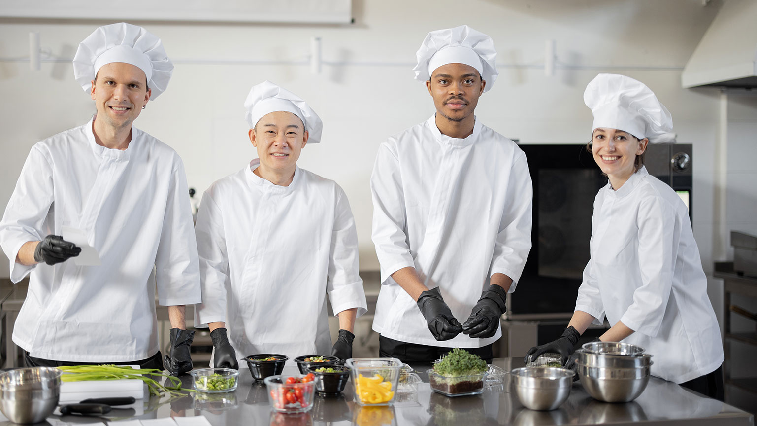 portrait-of-multiracial-team-of-cooks-in-professio-2025-03-13-08-20-10-utc